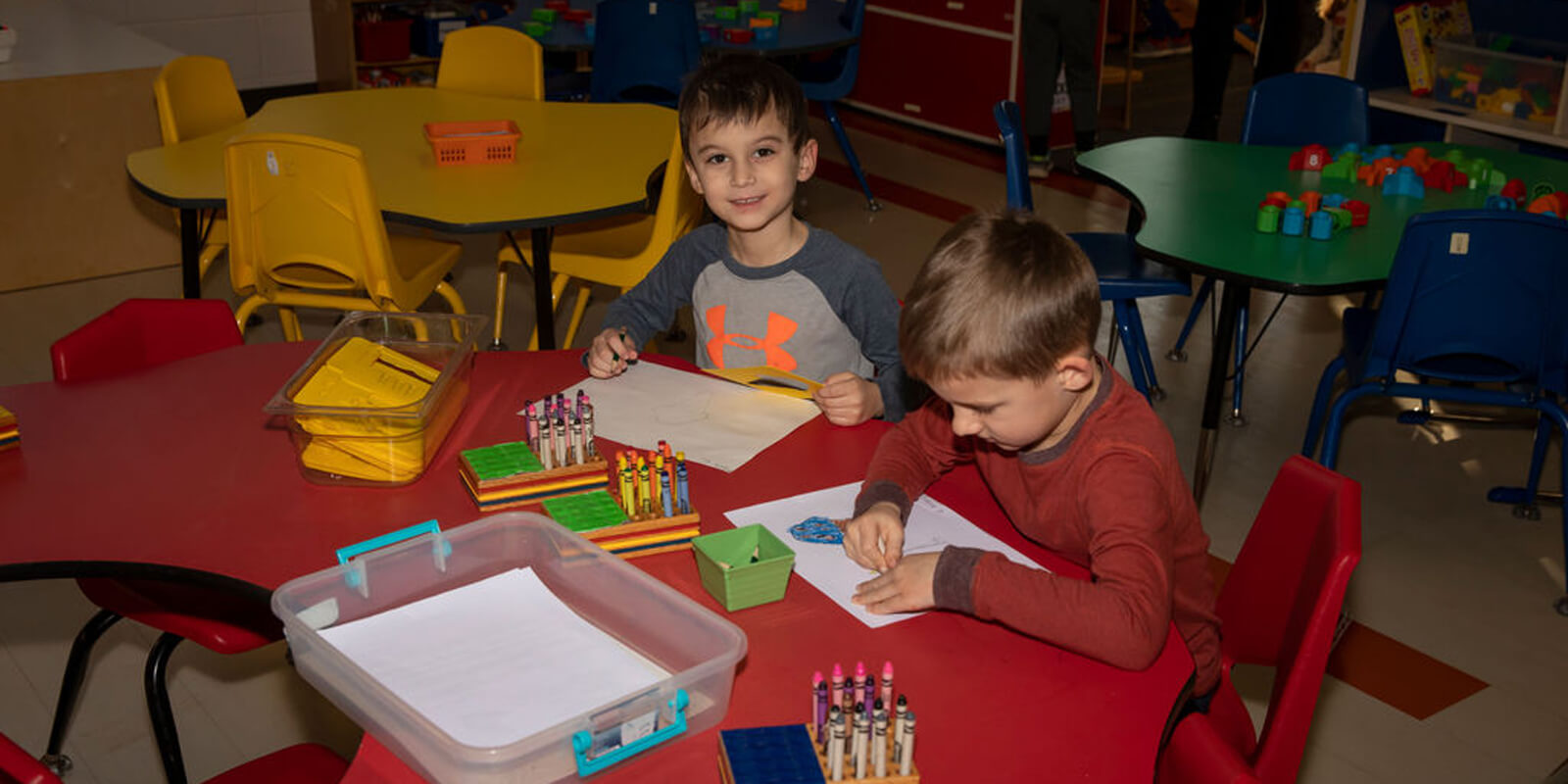 Kids coloring and smiling