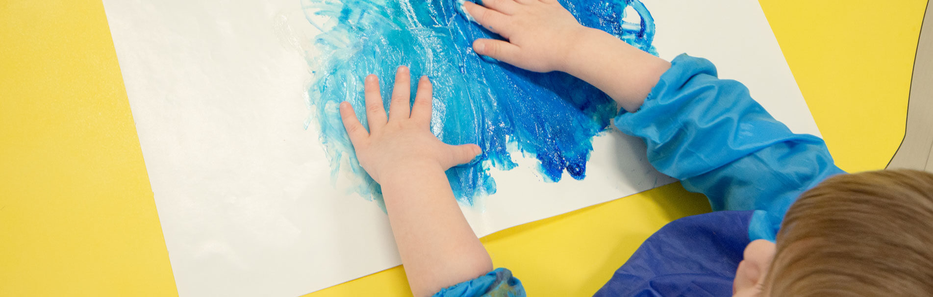 Child Painting With Hands